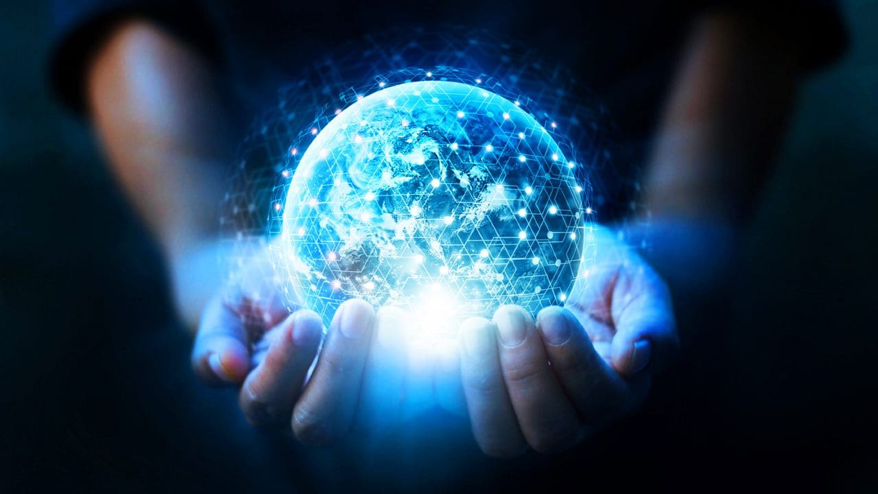Two hands holding a glowing sphere
