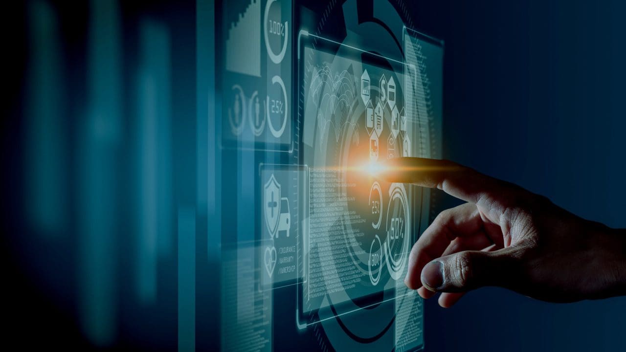 Finger touching a digital screen.