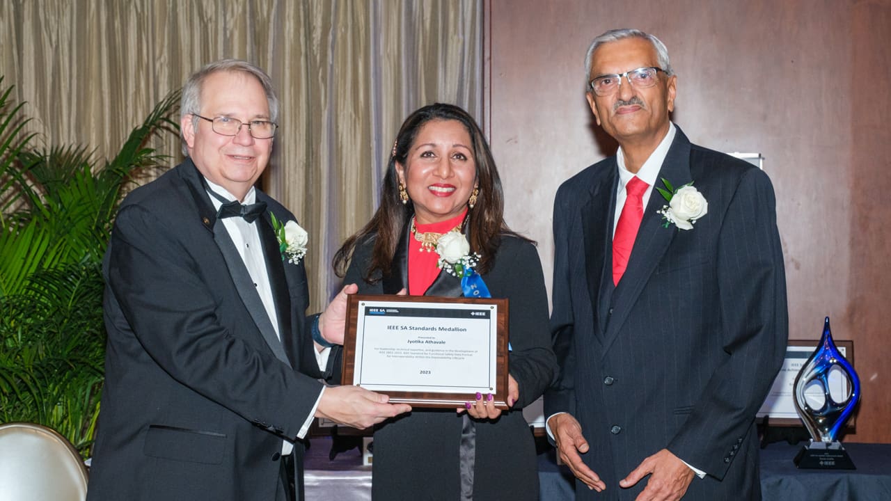 Recipient posing with award