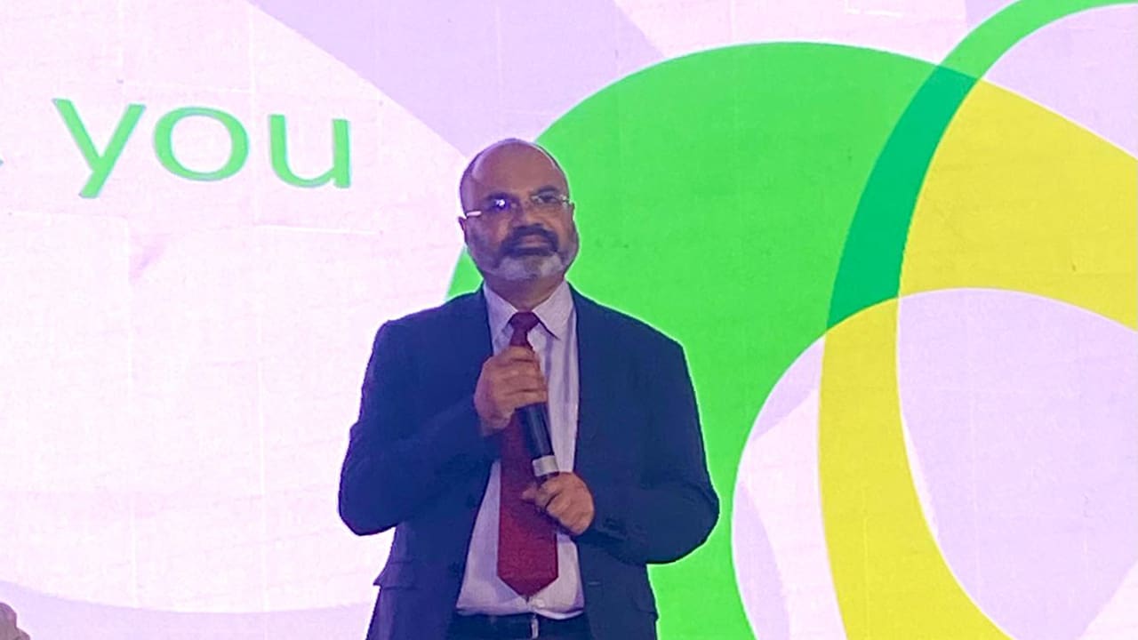 Sri Chandrasekaran standing on stage at World Telecommunication Standardization Assembly (WTSA-24).