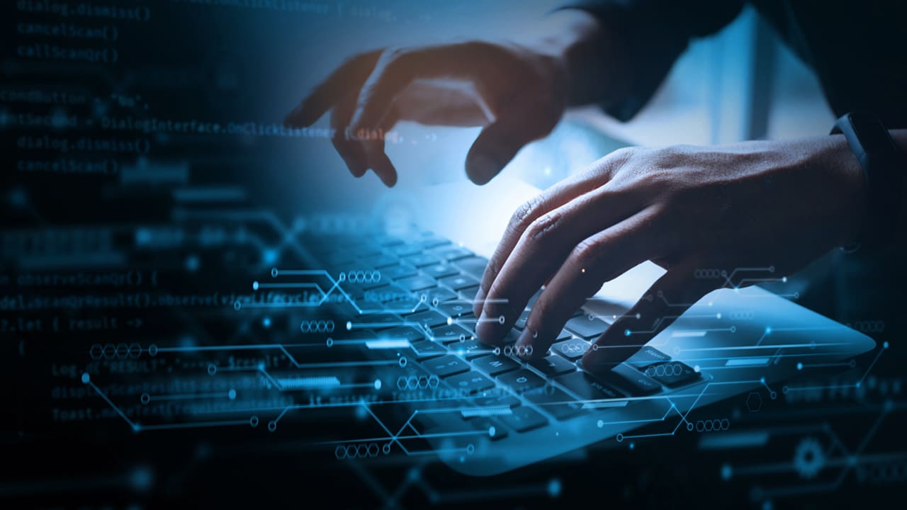 Person typing on keyboard